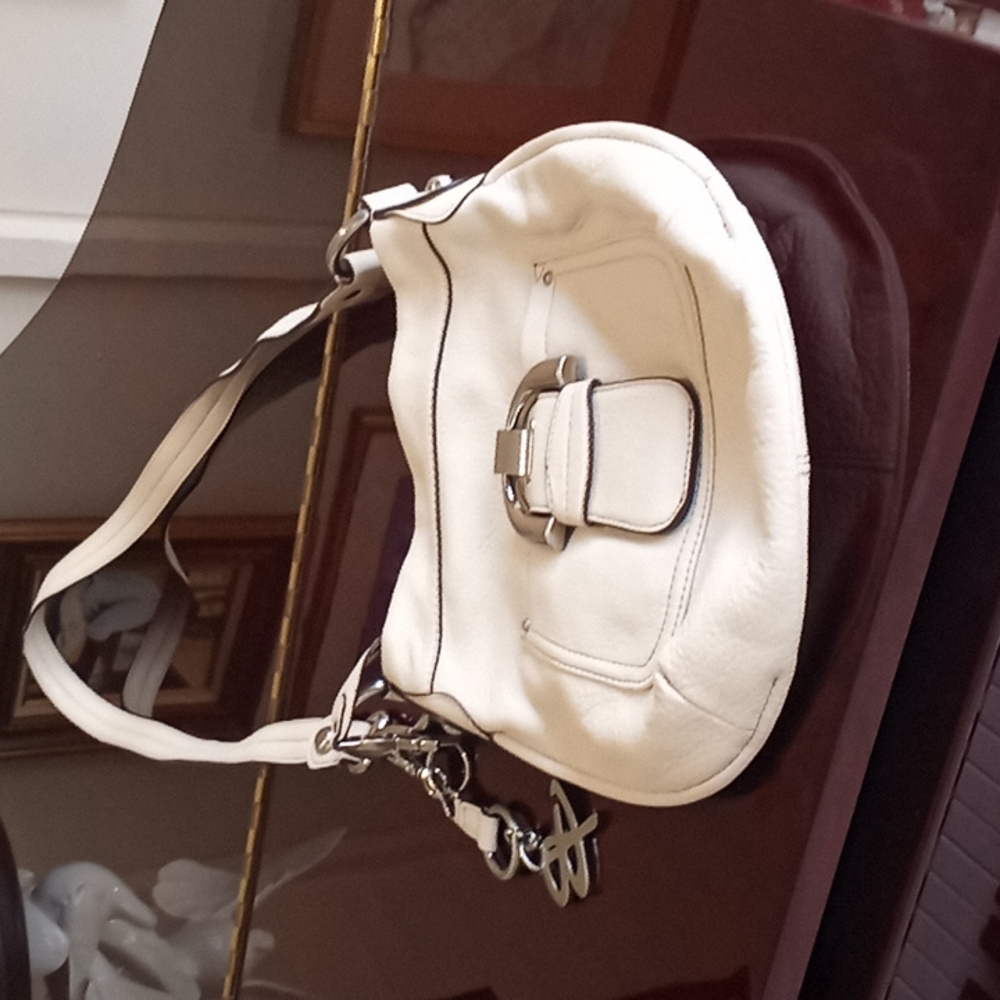 Handbag designer  B Makowsky color cream